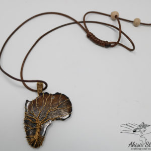 Ethical tree of life on brown cowbone pendant.